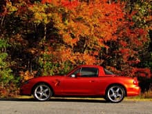 2005 Mazda Miata Speed, Lava Orange.  There were only 394 made, and this was the only year with this color.  The matching hard top is very nice when the weather turns cold. The turbo charged Miatas where only made two years, 2004-2005.  The dragon is Photoshopped on the side.