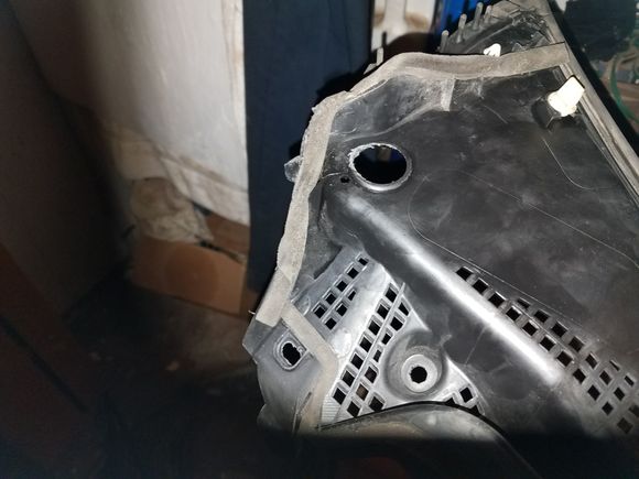 passenger side cowl piece - make sure everything's aligned perfectly before you start pushing the pieces back into place.  There's clips all along each piece that hold them in place.