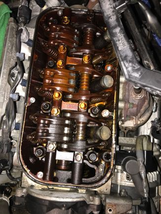 At 135k at the very least the upper plenum did not look like this. It was jus a bit bronze looking but not black gunk. At 135k I had it opened up cleaned following items egr port, egr valve, throttle body. Replaced pcv valve then also with aftermarket valve. At around 150k changed pcv valve with oem valve. Soon after decided to change leaking front valve cover gasket and this is what I was greeted with. 