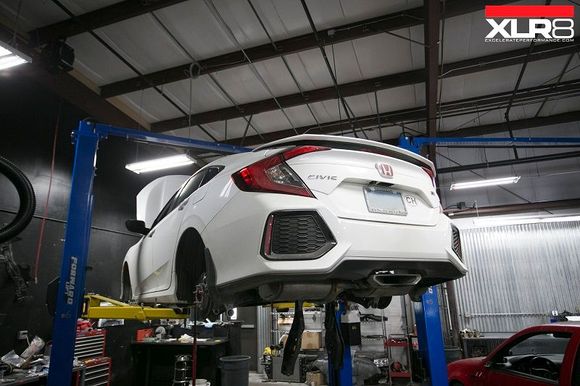 The Civic Si up on the lift being pulled apart for it's long list of upgrades. Ranging from suspension mods, to downpipes, and shifter mods.