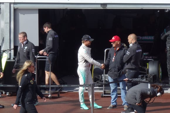 Nico comes out and shakes Lauda's hand (after running up and down the stairs next to Hamilton's garage about a dozen times)