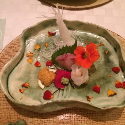 Uni, amberjack, flounder with edible flowers grown in Chef's kitchen