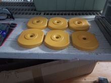 Manual lathe leveling pads. 