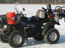 2003 TRV with Rapid Shack Ice shelter.3HP ice auger, Mr Heater and Vexlar in the ice bucket.  Lunch is in the gray bag. Tires from a 2005 AC 650.                                                   