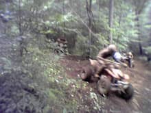 Glimpse of a Honda 450R using a shortcut to pass.  It looks legal but it's really not.  If the cheaters get stuck, we don't pull em out.                                                                