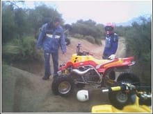 scene of accident, my view coming down the trail, you can barly see my quad behind the guy in front of the banshee
