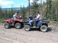 Here is a picture of my wife and 2 of our daughters. The polaris is now gone and a 06 limegreen AC TRV 500 is on its way