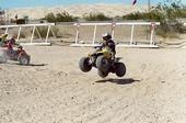 Zach jumping his stock LTA50. Too bad the suspension couldn't handle his riding style.