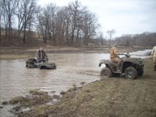 My brother in law getting towed out of a water hole