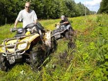 me pulling a polaris sportsman out of a mud hole