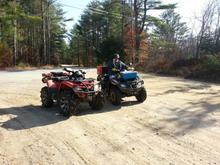 moose sitting on his new 2012 outlander 650 max and my 2011 outlander 800 max- a little off the trails...