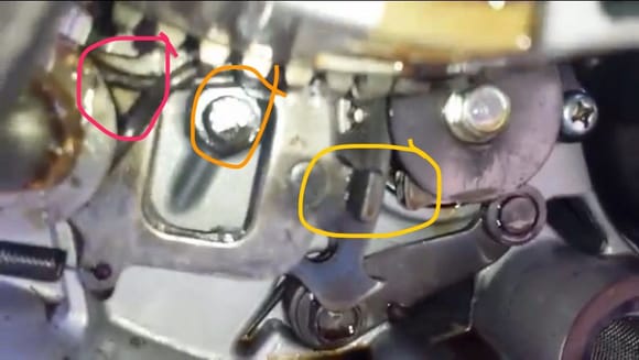 The red circle is the spring I'm referencing, this picture is from the video but mine was in the same place. 

If I move the spring down over the tab circled in yellow, you can't shift the quad at all because the spring gets caught on the stopper marked in orange. 

If I go below it the spring just falls, and I already know going above it all is incorrect, so what should I do? Hahah thanks again.