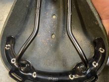Brooks says made in England inside the frame

And honestly, the rivet work looks cleaner on the knock off. 

For $15, wish I bought it now. (The brown one)