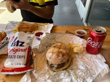 Amazing bratwurst sandwich with sauerkraut and mustard.