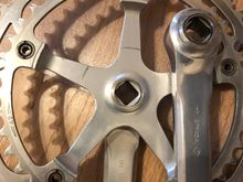 To accommodate the "lip" derailleurs, Campy also changed the offset of the crankset. Note this is a 1977 (<7>), which is the first year that they had to do this, so this is a late 1977. Note the "dome" on the inside, which is smaller than the pre-late 77 dome...