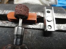The modification; remove a bit of the pad with a Dremel and sanding wheel.