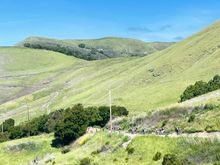 A line of cyclists on the lower slopes