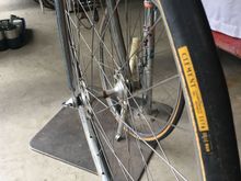 Probably the original front tire. These bikes came with 27" tubulars. The wheel in the background is a 27 x 1 1/4 which he probably had built so he could use clinchers. It's sporting a Schwinn Le Tour.