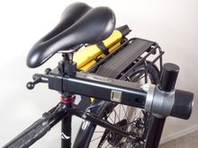 Note the absence of the flimsy Topeak slotted front mounts on the rear rack. The mounts used are from an old Axiom rack. The Topeak Super Tourist DX (disc) rear rack was chosen for it's superior support of the stiffner on the back of the rear-roller bags. Using the Axiom front mounts actually 'boxes' the seat stay, making it less flexible. This wa shte strongest solution I could come up with for putting a load on the rear of a relatively lightweight cross frame. Handling is precise.