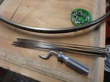 Gathering up the right spokes for the non-drive side of the wheel.  In my case 9 or half of the 18 NDS spokes.