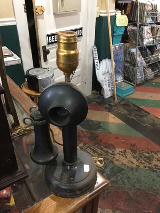 Stopped in an resale shop.  Although repurposed into a lamp, this candlestick phone caught my eye 