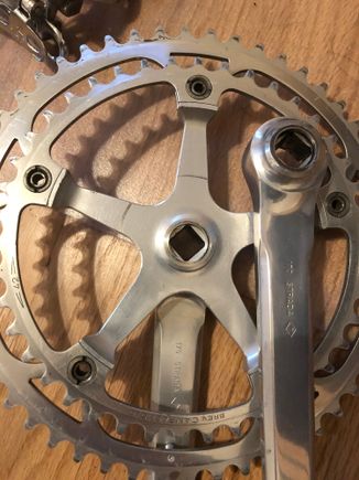 To accommodate the "lip" derailleurs, Campy also changed the offset of the crankset. Note this is a 1977 (<7>), which is the first year that they had to do this, so this is a late 1977. Note the "dome" on the inside, which is smaller than the pre-late 77 dome...