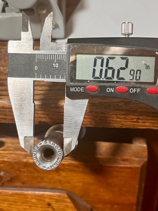 Diameter of the spindle is about 0.629, pretty much exactly the diameter of the crank arm opening, no room to slide on...