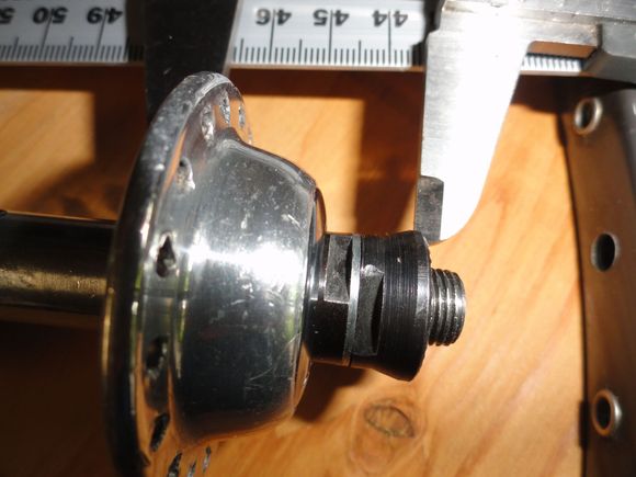 The non-drive side flange  to over-nut measurement