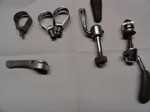 Three lever clamps for late model Campy levers. One shift lever orphan, and two seat clamp quick release mechanism.  One has had the rubber cover pulled off but is a useable unit.