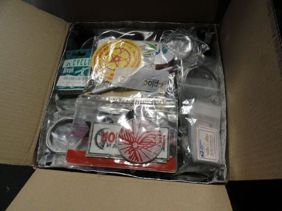 The box brimming with plenty of working parts and some new shop stickers.  Ready to be sealed up waiting for players to sign up.