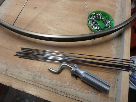 Gathering up the right spokes for the non-drive side of the wheel.  In my case 9 or half of the 18 NDS spokes.