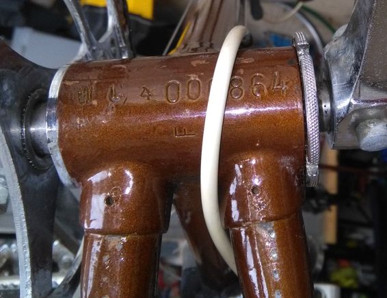 Appears to be W L 4 000864
(4 is questionable)