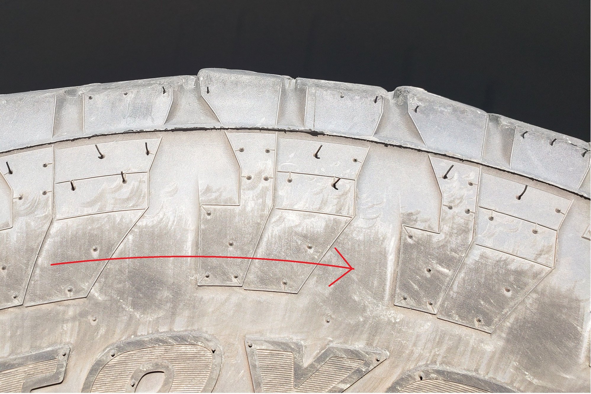 This is the right-rear tire. I added the arrow to remind myself of the direction of rotation. This pattern is called heel-toe wear. 