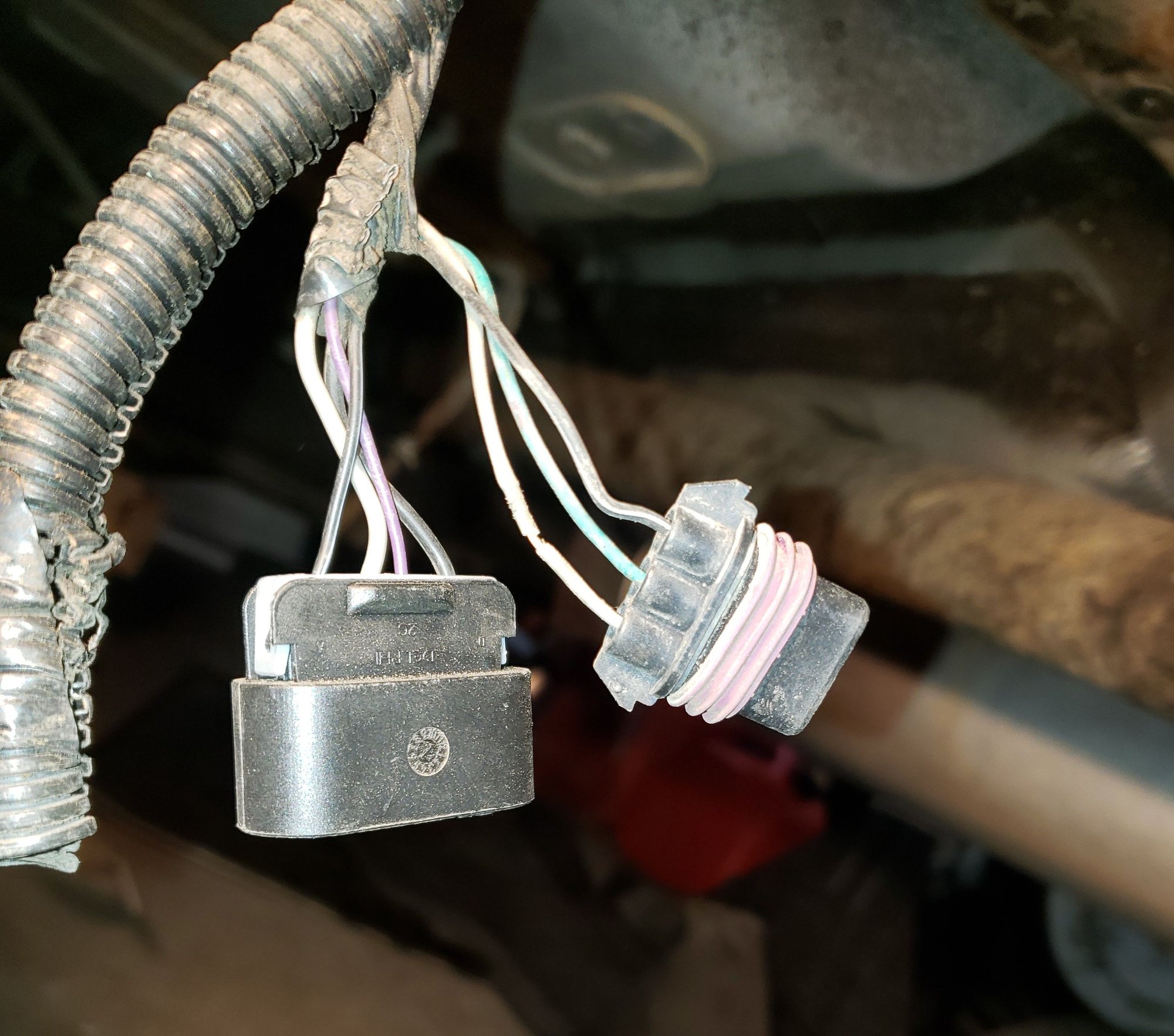 Final assembly and the wire with the broken insulation on the connector for the tank pressure sensor.