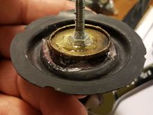 The vacuum advance uses a threaded rod as part of the mechanism to adjust the initial tension on the spring and the amount of advance/retard allowed. Used a bolt to replace this. 