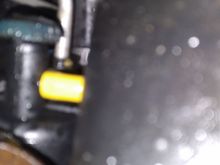 Piece of screwdriver handle i added to the petcock to make it easier to open and close.yelliw cap is to stop a dribble im getting on the new rad. Seems to work.