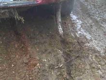 In the end, the exhaust got ripped off, which cut the right rear brake hose off, and the TCCM went out and the front valance panel was broke in half and a dent in the passenger side door, from a stump in the water hole. That is probably the only thing that kept the truck from over turning into the hole...