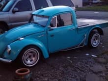 this is my vw now that ive had a chance to monkey with it. im gonna paint it hopefully this summer. im gonna go with a bone white in a matte finish. all my lights are clear and with the white walls i think the off white will look good. and matte is kinda hot rod. :)
