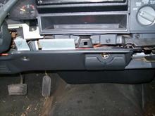 Screws below the radio