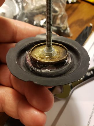 The vacuum advance uses a threaded rod as part of the mechanism to adjust the initial tension on the spring and the amount of advance/retard allowed. Used a bolt to replace this. 