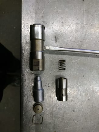 modification of an old hydraulic lifter.
left side is the assembly with a fixed piece of rod turned on the lathe, quick and dirty to have a second lifter to measure.
this effectively makes it a solid lifter without the spring.