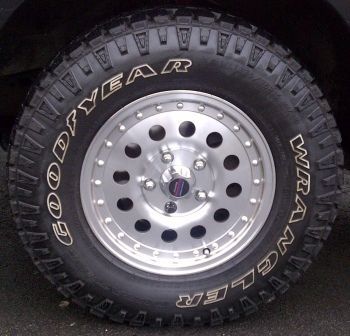 American racing ar23 from sears 15 x 7 with a 5.94 inch backspacing was for all four with balancing and mounting about $575... the tires are the (p235 75 r15 )duratrac from goodyear sold at sears as well for about that same price... so id say it was $1100 well spent on a great package if you cannot afford to lift but can get a sears credit card