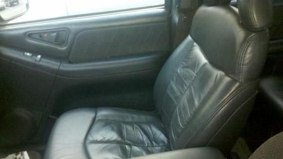 Passenger seat converted from cloth to leather.