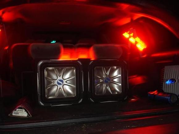 since replaced the red lightning neons with blue in the windows and a blue plasma on the subs. 12" kicker L7's rockford punch 1100 watts, capacitor, otima red top. also added a PA system for some extra fun.