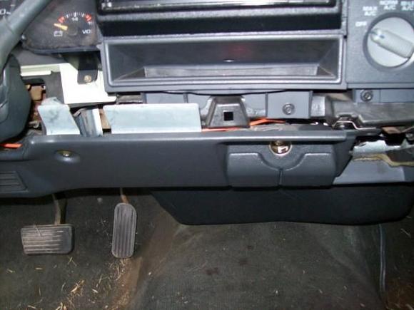 Screws below the radio
