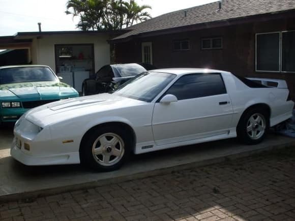 Well, here she is Bros, my 92' Z and INDEED! she's, been SCREAMIN for some chromies[20&quot; Iroc Replicas], for far too long now =) You know, i actually got her off a some Cop, for like 5k back in o2'. Yeah, she still has all the wiring harnesses and toggle switches for the strobes and such. But, that's as far as it's gonna go. Then again, a few beers later...? Who knows =) But, as far as mods though? I swapped the original 350 with an LS2 6L Crate Motor and mated her with a TH700r4 Super Sport tranny from Monster Transmission and Performance. 9&quot; Moser with 3:73 Posi in the rear and like all my other cars... I've also added a full exhaust[Super Comp Ceramic Coated Hooker Headers, Custom Y pipe from DJ Motorsports/ 2 Chamber Super 40 series Flowmasters], As well as a WHOLE bunch of other stuff[Leather Interior/ Aftermarket sound system/ HID kits in both head and reverse lights/ full Baer Brake system upgrade/ Bilstein shocks and struts/ Eagle F1's/ etc/ etc/ etc.......... All that's really missin is a Supercharger. But, i'll get there eventually. So yeah... Lets jus say i'm workin on it =)

As for the other cars you see in the back ground. The green one is my 88' SS Monte Carlo and the black one is my 01' Bullitt Mustang. I tried uploading them here. But... Oh well, maybe i'll try again later...Lol =) If you do wanna see them though i have the link in my other album. Ayt! later Bros...