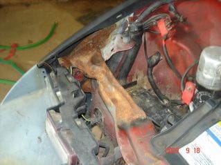 damage under the hood, anyone ever replaced these bent and rusted parts?