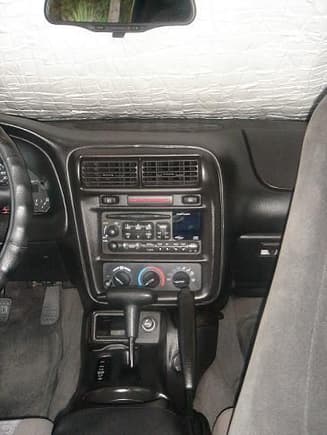 Centered dash plaque and Firebird T-handle automatic shift knob.