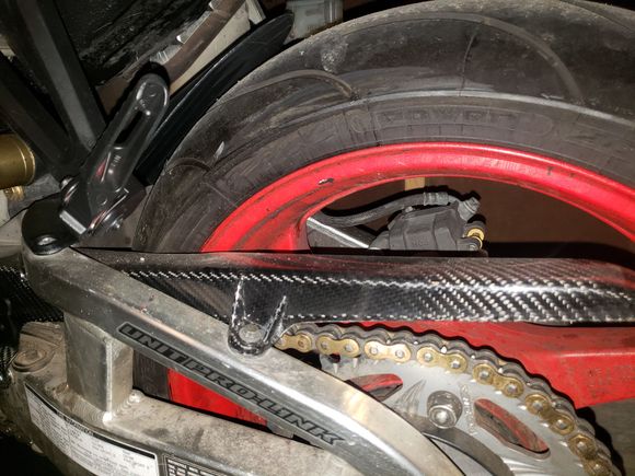 Put a carbon fiber chain guard on in place of the ugly black plastic.