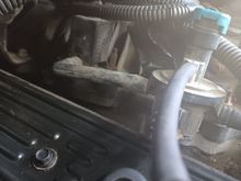 Same issue, pcv valve goes in the hole at the bottom then a hose goes up to air intake.  Not sure if a T goes above the pcv  so you can connect the little vacuum hose to it but thats what it looks like and i saw a T like that on rock auto.  Any information you can share with me would be appreciatted if you figure anything out.  I will post agian if i fix it.